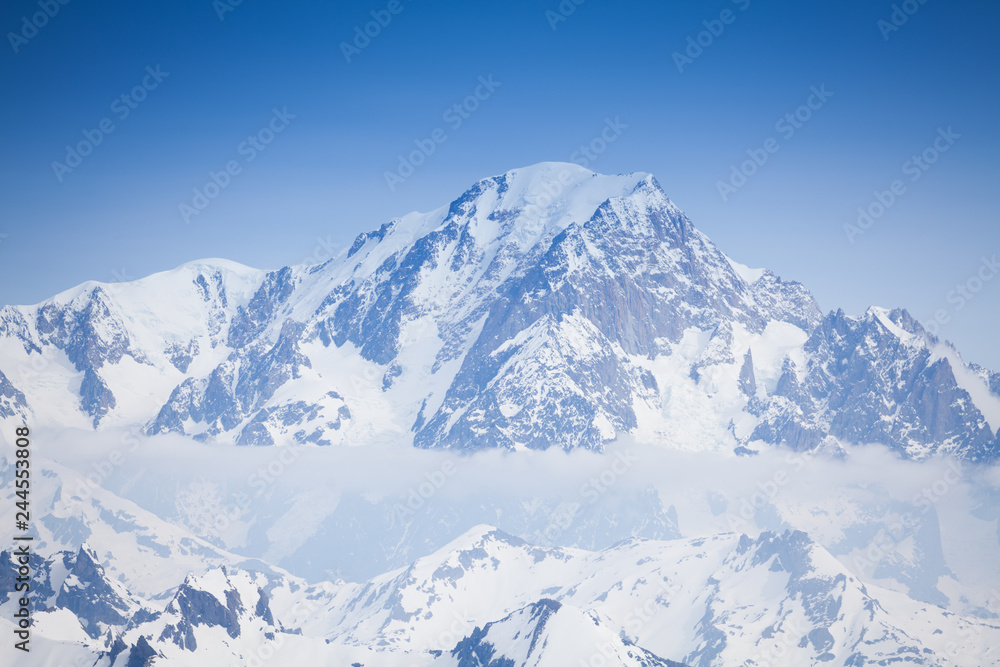 Wall mural beautiful view of snow mont blanc peaks and clouds