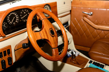 interior of the car is a brown color and leather