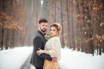 a walk of the newlyweds in the forest