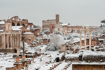 Winter in Rome. Snow falling on Roman Forum ancient ruins