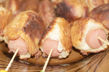 Sausages fried in batter. Sausages in the dough. Hot Dog. Sausages on skewers. Deep fried. Food. Breakfast.