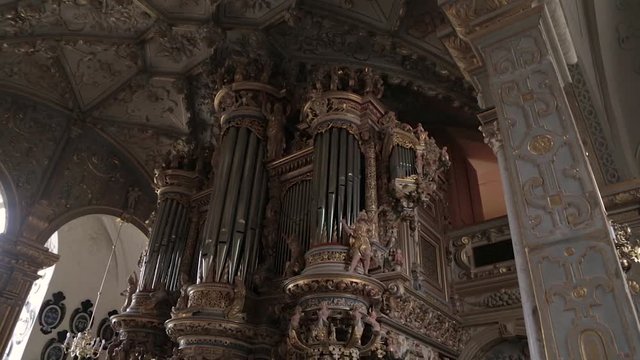 Organ in a church. Fragment of decoration of the organ of the palace church in the Frederiksborg Castle. View of the Compenius Organ of the Frederiksborg Castle Chapel (Slotskirke) from the balcony.