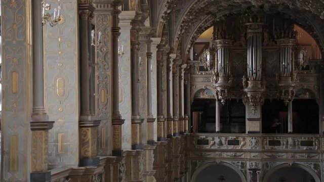 Organ in a church. Fragment of decoration of the organ of the palace church in the Frederiksborg Castle. View of the Compenius Organ of the Frederiksborg Castle Chapel (Slotskirke) from the balcony.