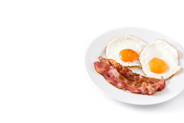 Fried eggs and bacon for breakfast isolated on white background. Copyspace


