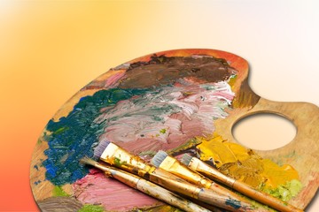 Row of artist paint brushes on background
