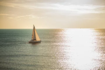 Fototapeten Sailing towards the sun © Nazario