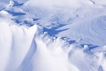 A cold winter day.Drawing on snow.Snowdrift.Abstract background.