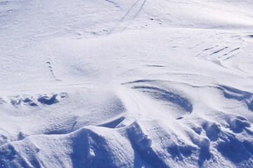 A cold winter day.Drawing on snow.Snowdrift.Abstract background.