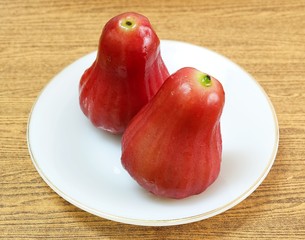 Two Red Water Apples on White Plate