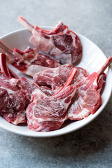 Raw Frozen Bloody Lamb Chops Meat in Plate