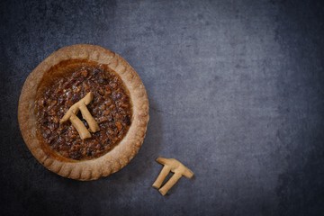 Mini pies with baked Pi day symbol  top view