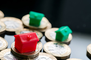 Housing estate concept with coins in studio