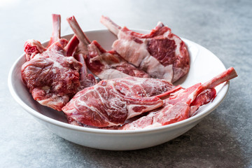 Raw Frozen Bloody Lamb Chops Meat in Plate