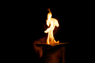 burning book in hand