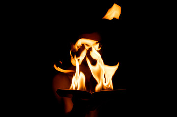 burning book in hand