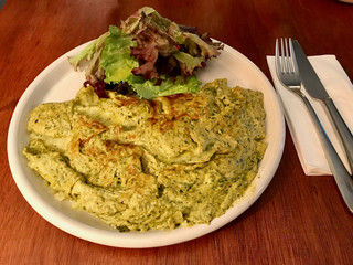 Green Omelette with Pesto Sauce and Salad served at Restaurant.
