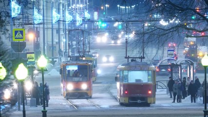 Tram traffic during winter on Lenin Ave in city of Yekaterinburg, Russia. Zoom out, 4K UHD Timelapse.