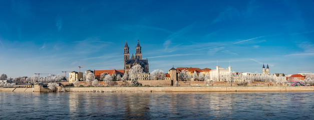 Panoramic view of first frost over amazing sunrise in Magdeburg downtown in Winter, Germany, sunny day, morning - obrazy, fototapety, plakaty