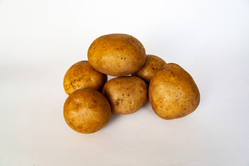 White ecological and very tasty raw potatoes for dishes and cuisine