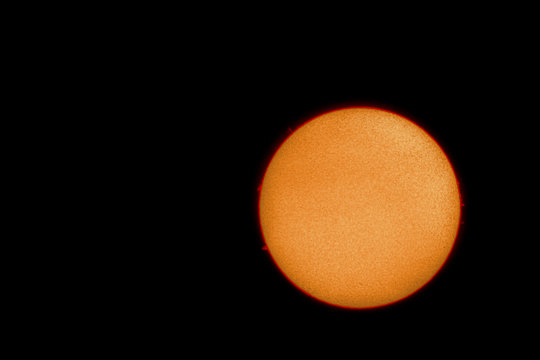 The grain-like surface of the sun with solar flares photographed with an H-alpha solar telescope from Mannheim in Germany.