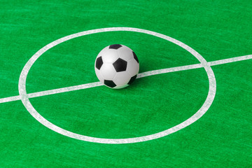 Fototapeta na wymiar Soccer ball on football field