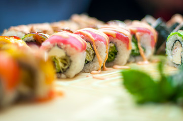 Rainbow Sushi Roll with salmon, eel, tuna, avocado, royal prawn, cream cheese Philadelphia, caviar tobica, chuka. Sushi menu. Japanese food.