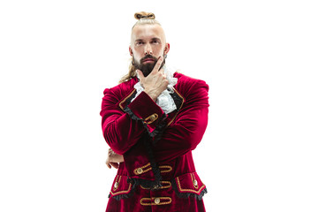 The young man wearing a traditional medieval costume of marquis posing at studio. Fantasy, Antique,...