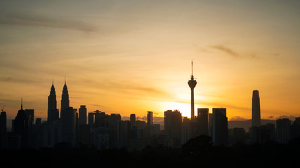 Fototapeta na wymiar Silhouette of Kuala Lumpur city during Sunrise
