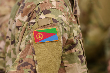 Eritrea flag on soldiers arm. State of Eritrea troops (collage)