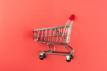 empty shopping cart on pink background. - for advertising and for copy space.