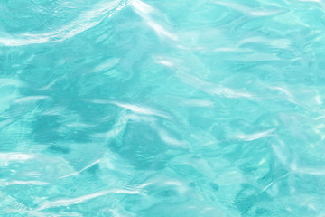 Underwater scenery, deep blue water of the ocean, air bubbles, waterline splitting skyline, divers discovering sea