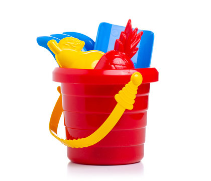 Baby set red sandbox bucket  shovel rake toy on a white background. Isola