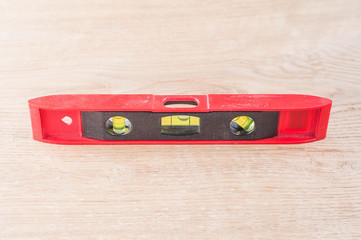 building level on wooden background