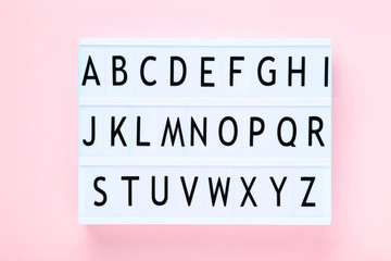 Lightbox with letters on pink background