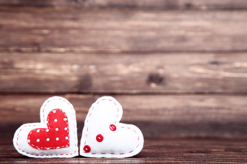 Fabric hearts on brown wooden table