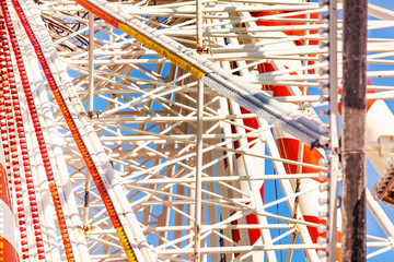 Ferris wheel construction against blue sky