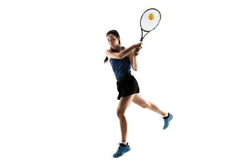 Full length portrait of young woman playing tennis isolated on white background. Healthy lifestyle....