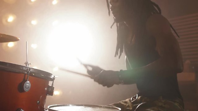 Crazy afro guy is keen on rock music. Strong music. Interest concept