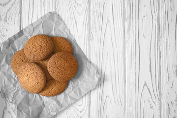 Homemade oatmeal cookies on light background.