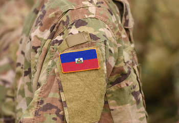 Flag of Haiti on soldier arm. Flag of Haiti on military uniforms (collage).