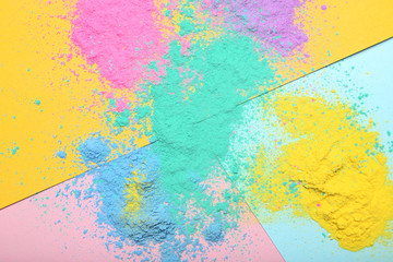 Holi powders on colorful background