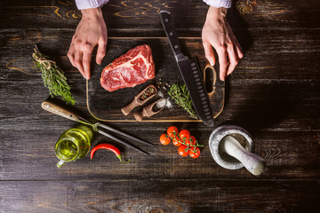 a piece of marbled beef. chef cooks steak