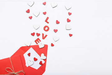 Valentine hearts with word Love and envelopes on white background