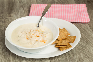Hot Sauce on New England Clam Chowder served with wheat thins