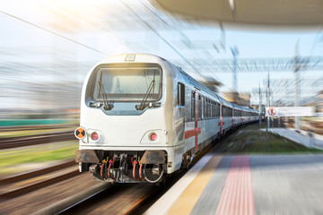 Obraz na płótnie Canvas Railroad travel. High speed train with motion blur effect.