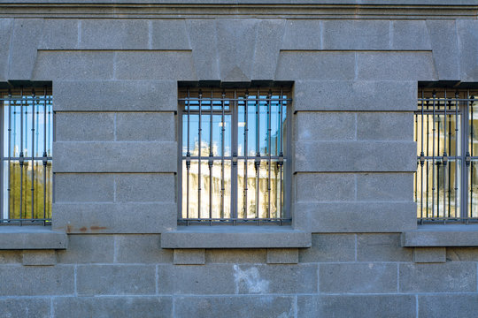 Wall of the building with barred windows
