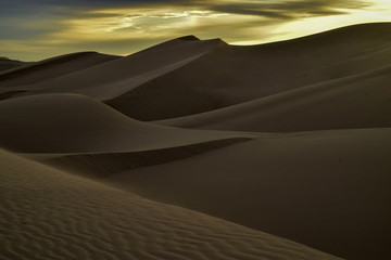 sunrise walk in sand dunes, Imperial Sand Dunes, California, USA