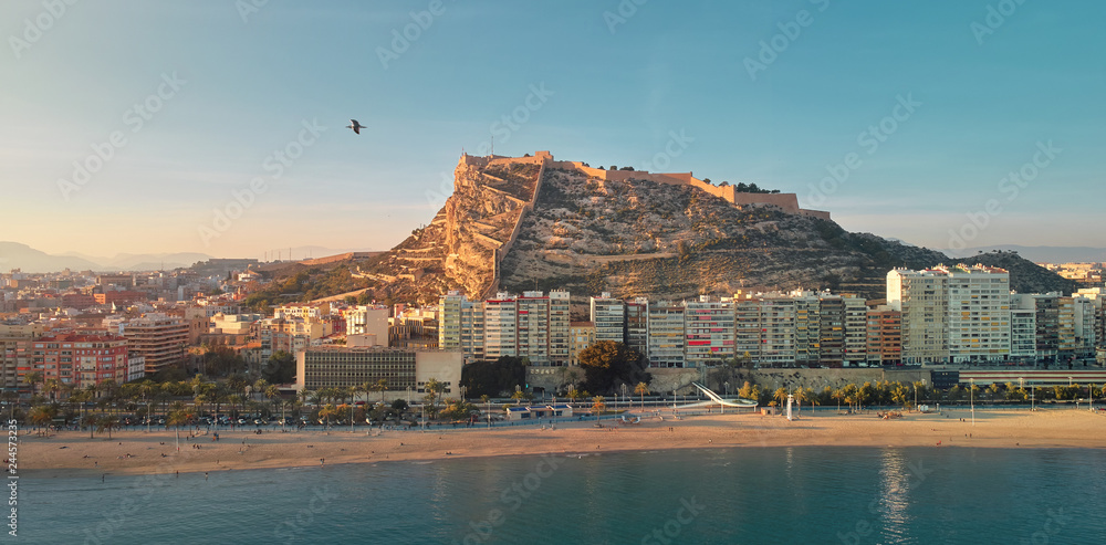 Wall mural Aerial waterside drone point view Alicante cityscape and beach. Spain