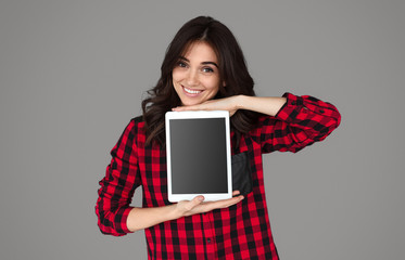 Cute female presenting tablet