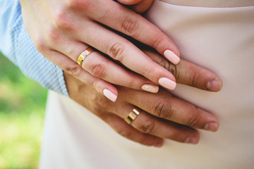 wedding rings. Newly wed couple's hands with wedding rings. Bride and groom's hands with wedding rings.